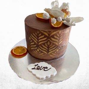 Dark chocolate ganache orange chocolate cake with sugar paste flowers