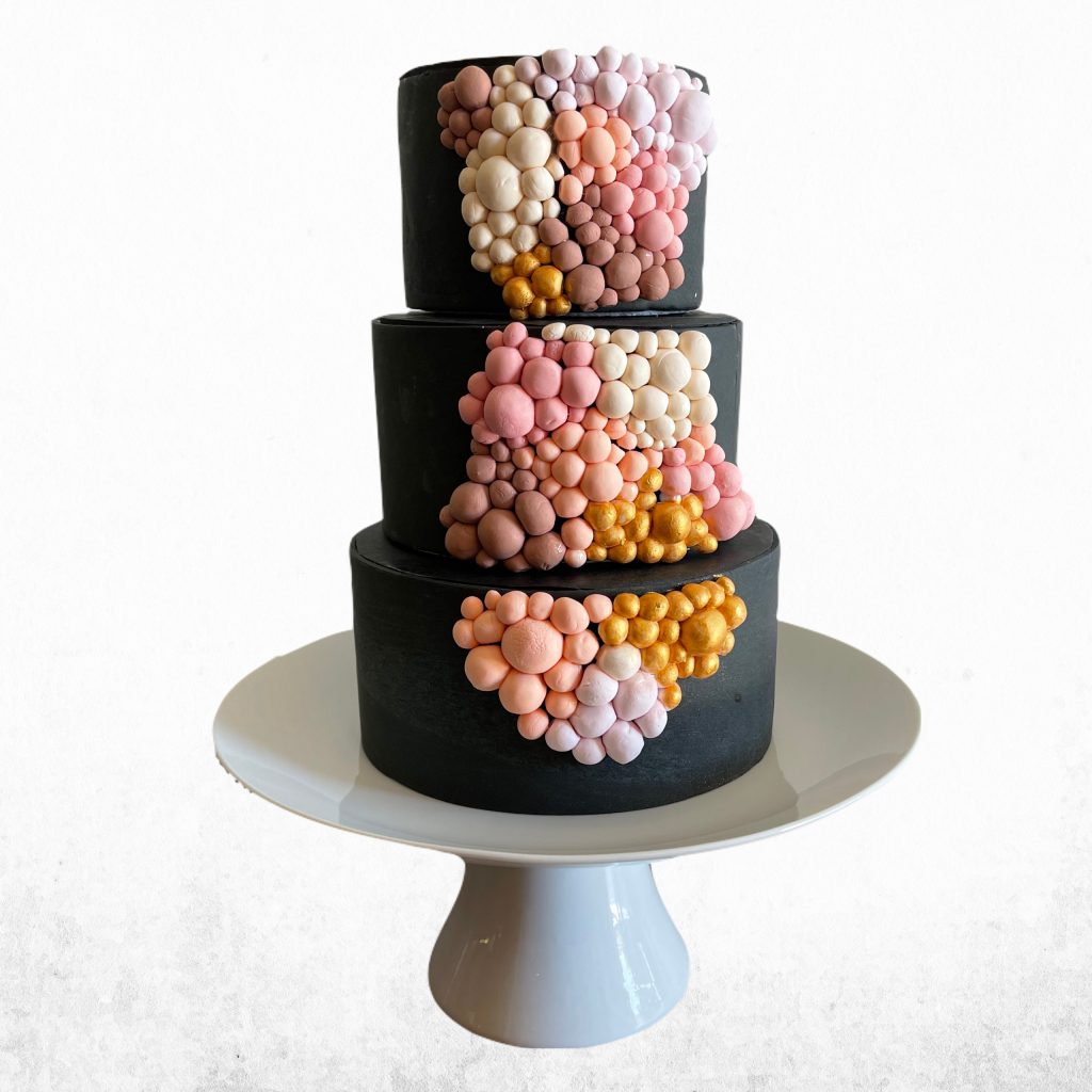 Dramatic 3 tiered black fondant cake