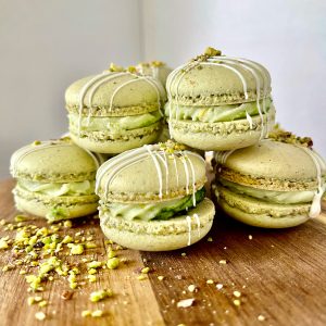 Pistachio macarons with white chocolate drizzle