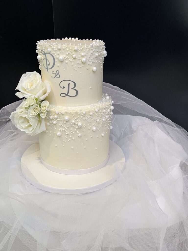 Elegant wedding cake. Classic white wedding cake.