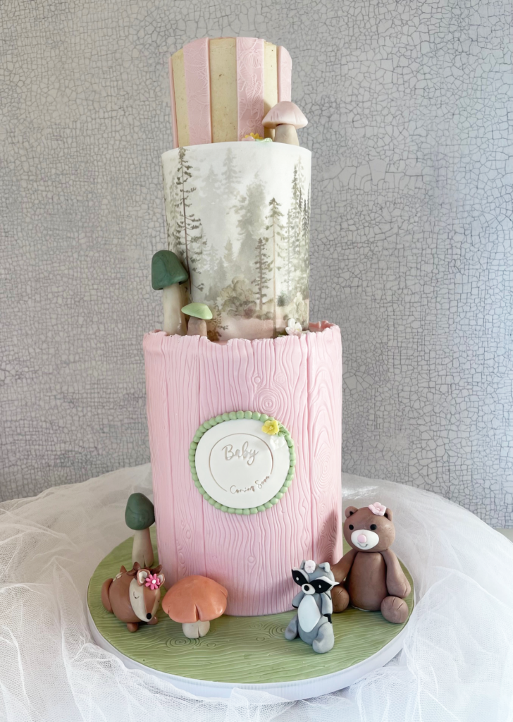 Woodland-themed cake with fondant animals