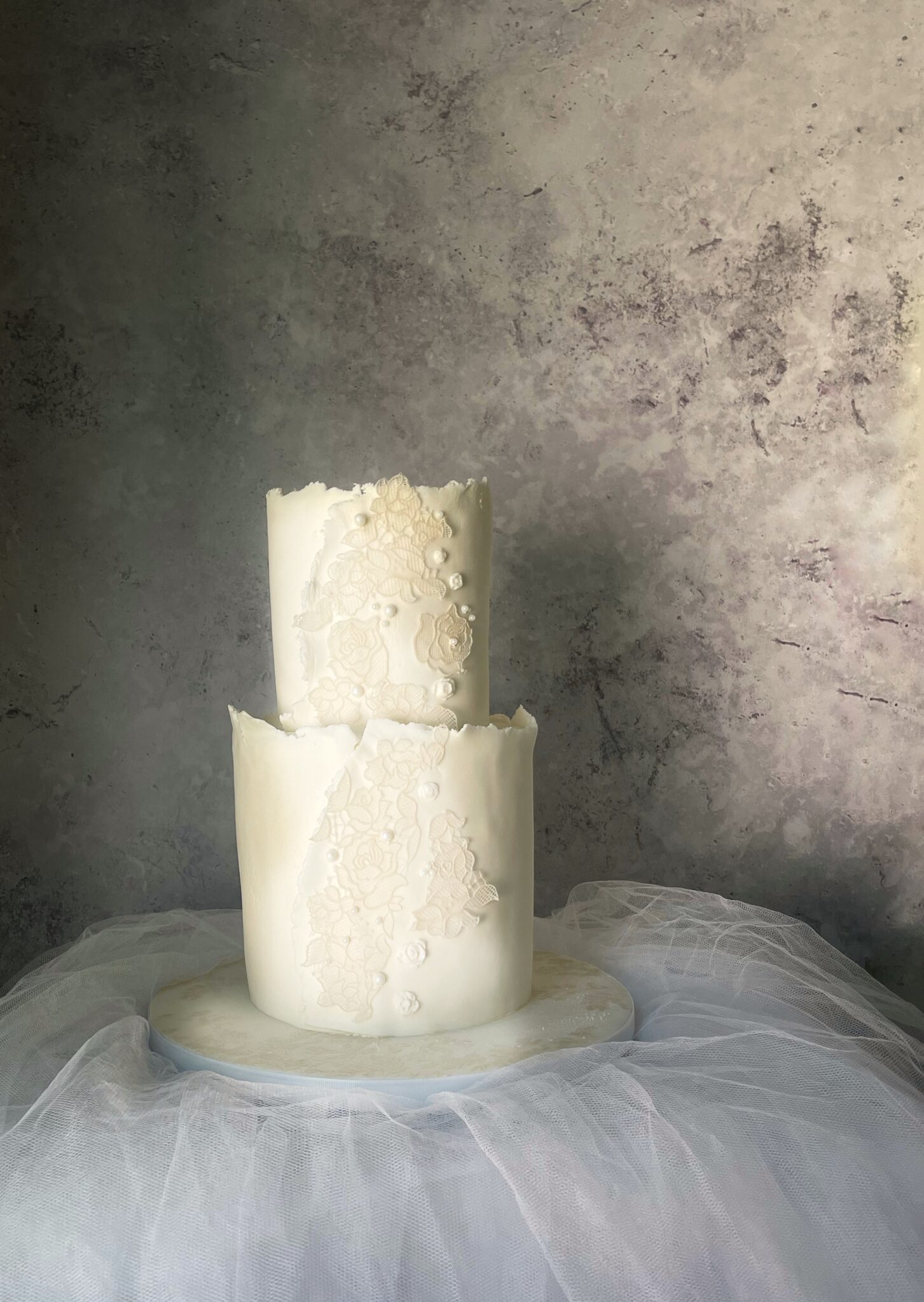 2-tier white and off-white wedding cake