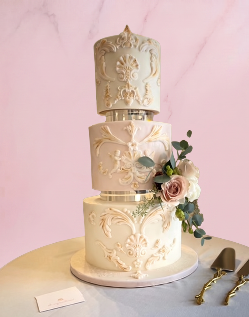 Ornate Ivory Wedding Cake with Romantic Floral Details
